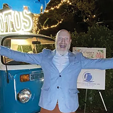 CEO Mark Waterson in front of the Photo Bus